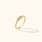 14K gold ring featuring a trail of asymmetrically arranged round-cut diamonds in a minimalist cluster design