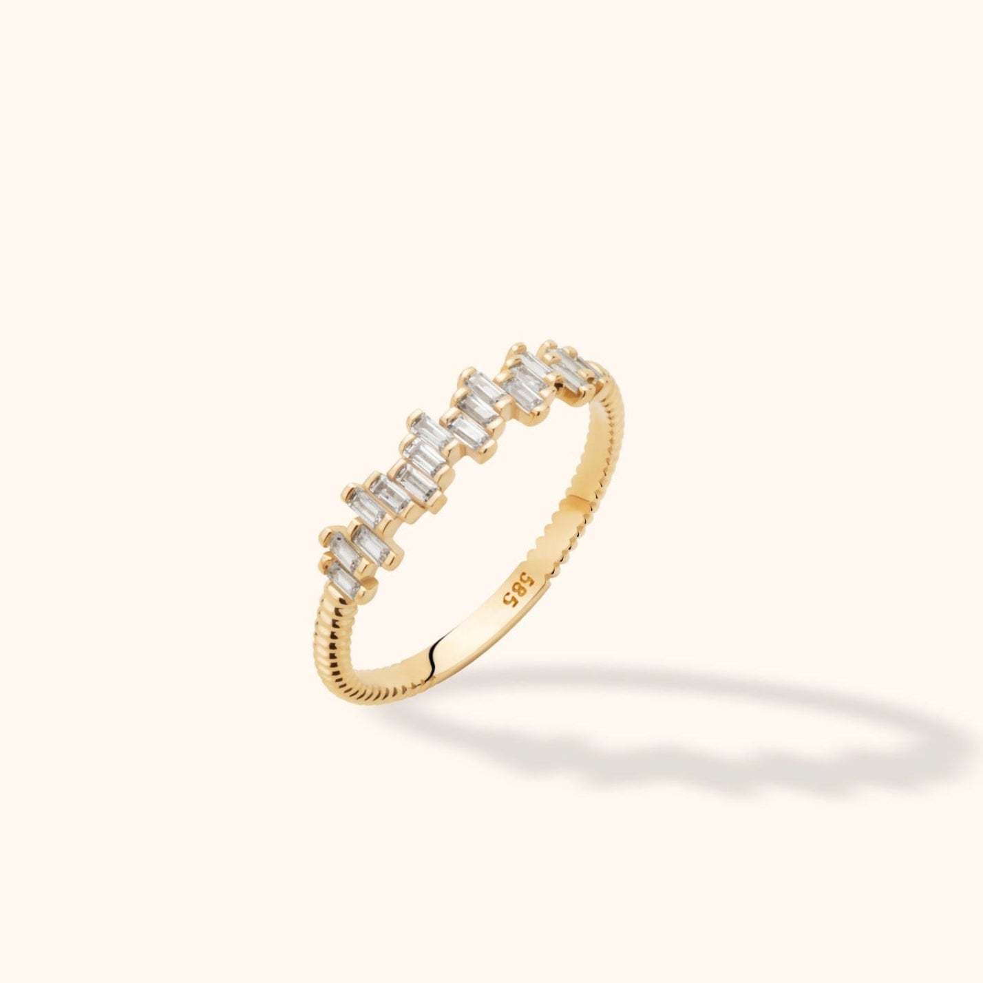 14K gold ring with baguette-cut diamonds and textured band design, delicate and stackable