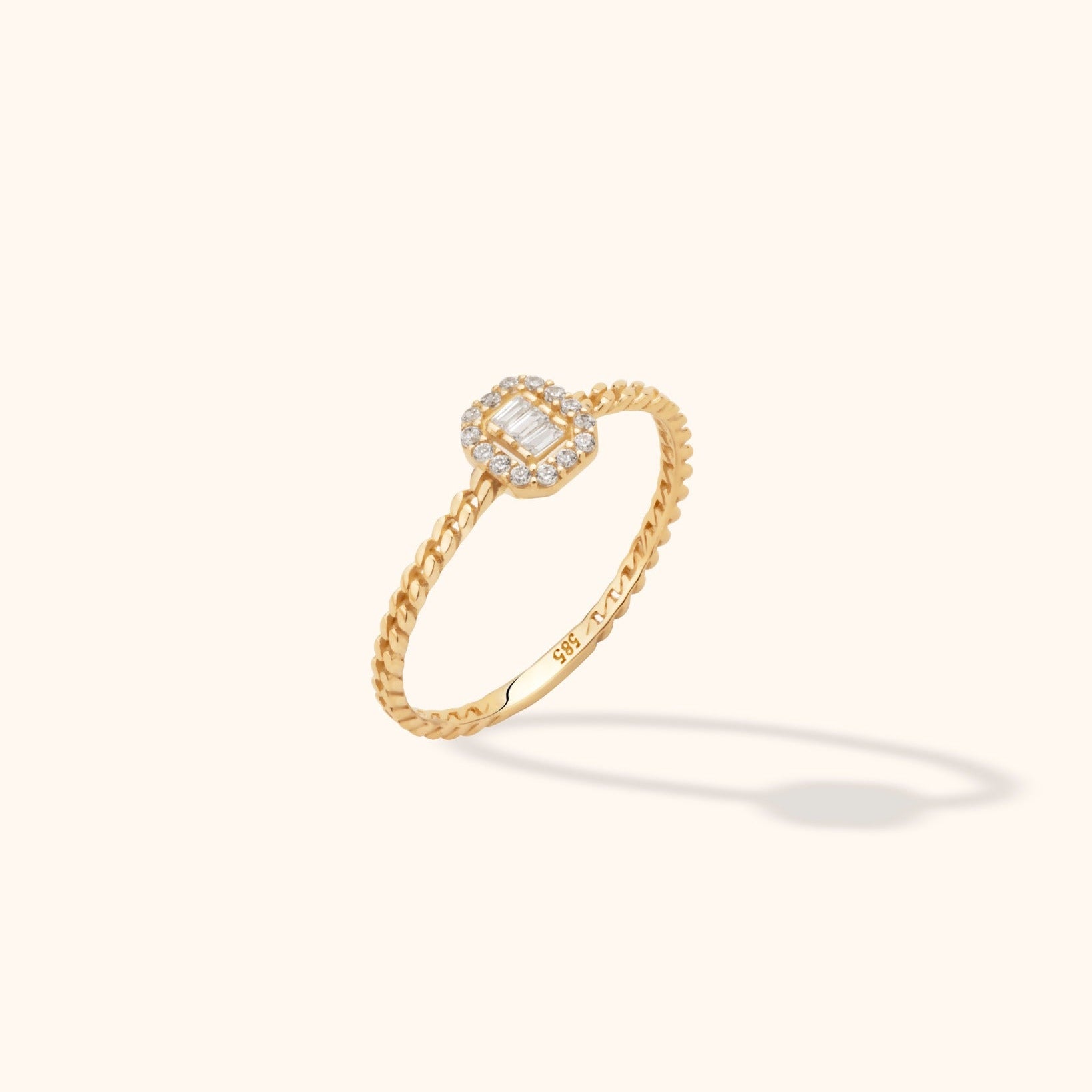 14K gold rope-style ring with baguette-cut center and halo diamonds in dainty vintage-inspired design