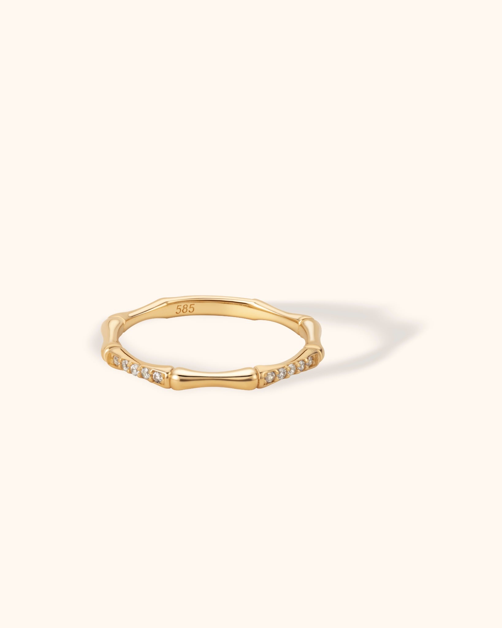 14K gold bamboo-inspired ring with pavé zircon accents, nature-themed elegant stacking band