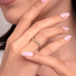 Woman wearing a 14K gold beaded dome ring with a bold textured finish on hand