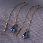14K gold threader earrings with pear-shaped blue sapphire gemstones on fine gold chain