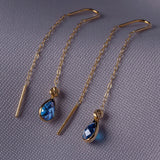 14K gold threader earrings with pear-shaped blue sapphire gemstones on fine gold chain