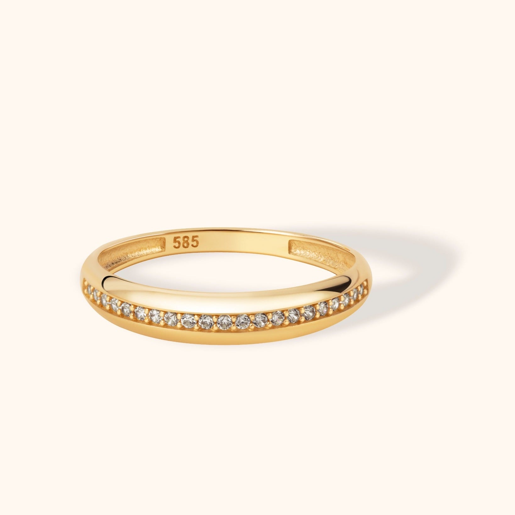14K gold ring featuring a sleek channel of round brilliant diamonds in a continuous line