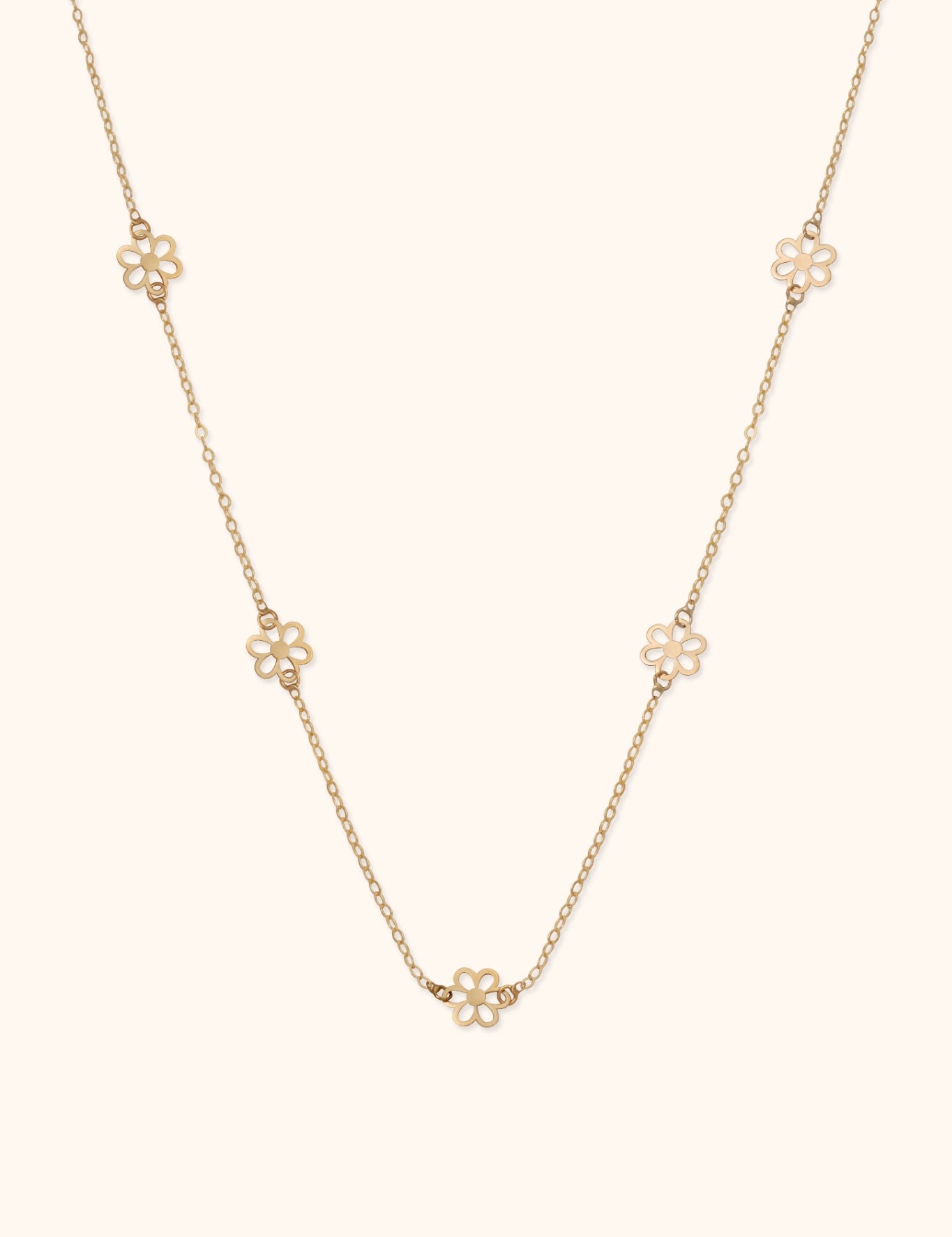 14K gold necklace with open flower station charms evenly spaced on delicate chain