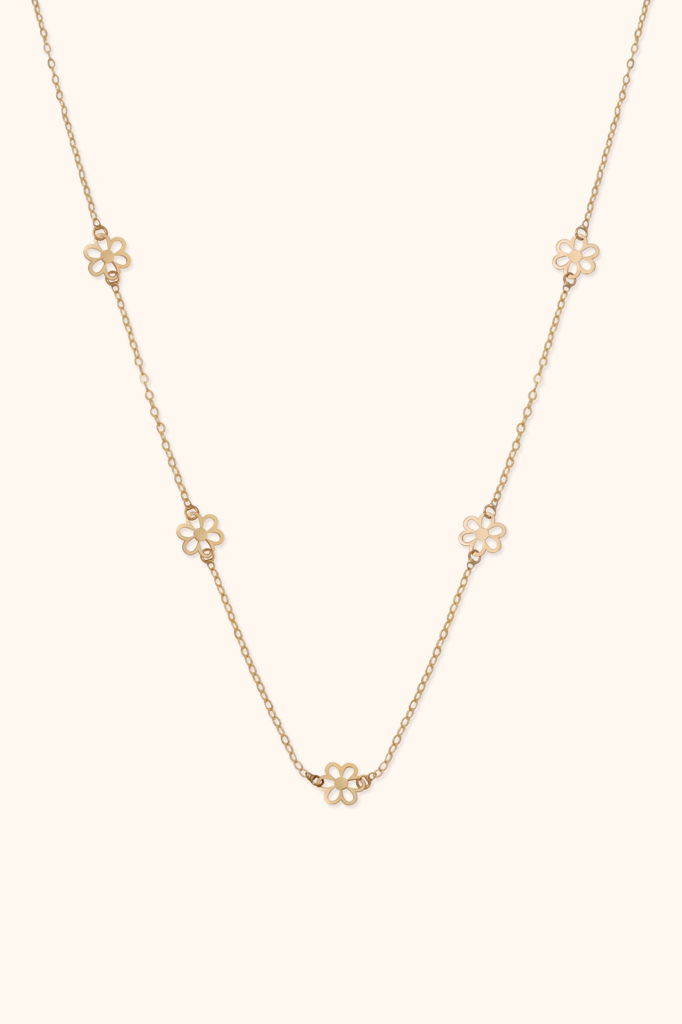 14K gold necklace with open flower station charms evenly spaced on delicate chain