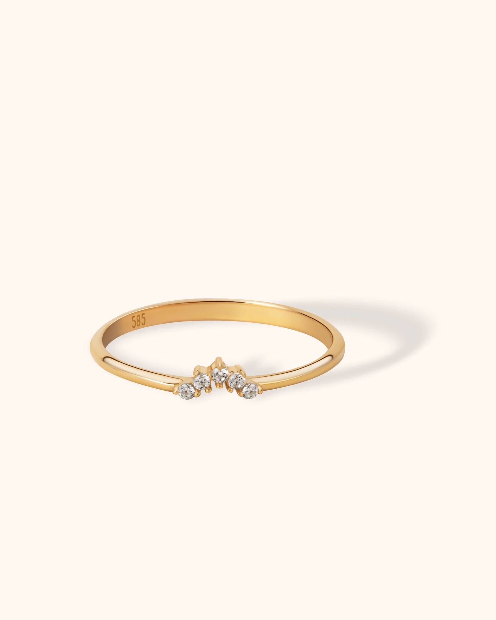 Minimal 14K yellow gold V-shaped ring with five small round diamonds, perfect for stacking or as a contour wedding band