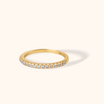Minimalist 14K yellow gold eternity band with round-cut diamonds in a full pavé setting, ideal for stacking or as a wedding band