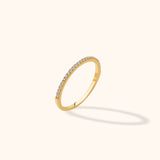 14K gold ultra-thin eternity ring with pavé diamonds encircling the full band in a delicate stacking style