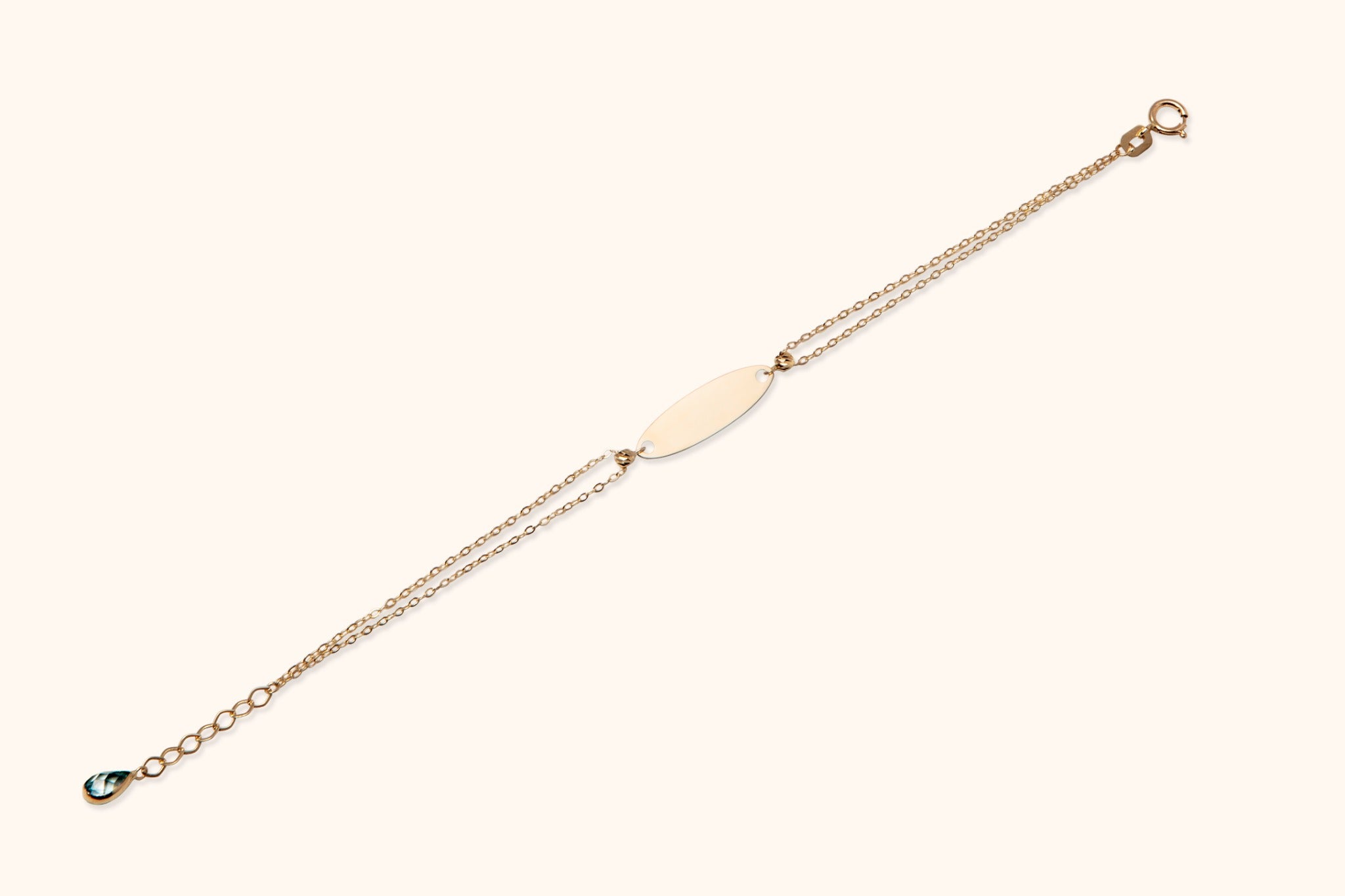 14K gold double chain bracelet with blank ID plate and teardrop crystal charm