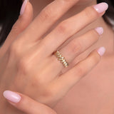 Model showcasing a bold 14K gold ring with double zigzag textures on manicured hands