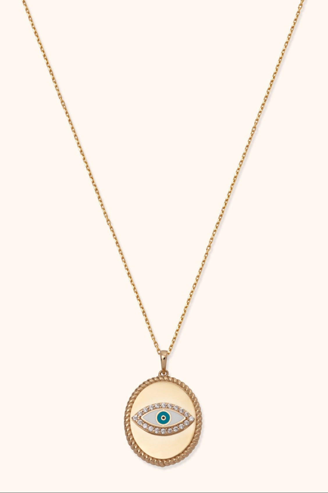 14K gold medallion necklace with evil eye design and diamond halo on twisted rope pendant