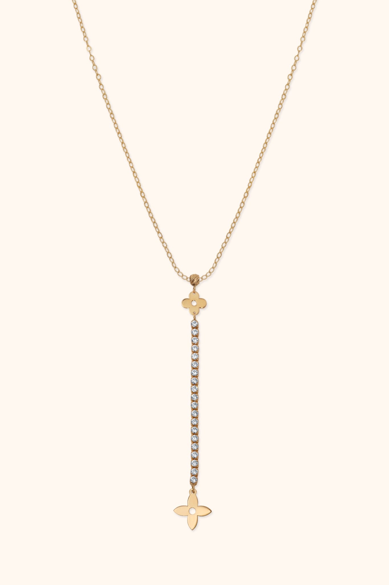 14K gold necklace with floral charm and vertical row of crystals forming a drop pendant