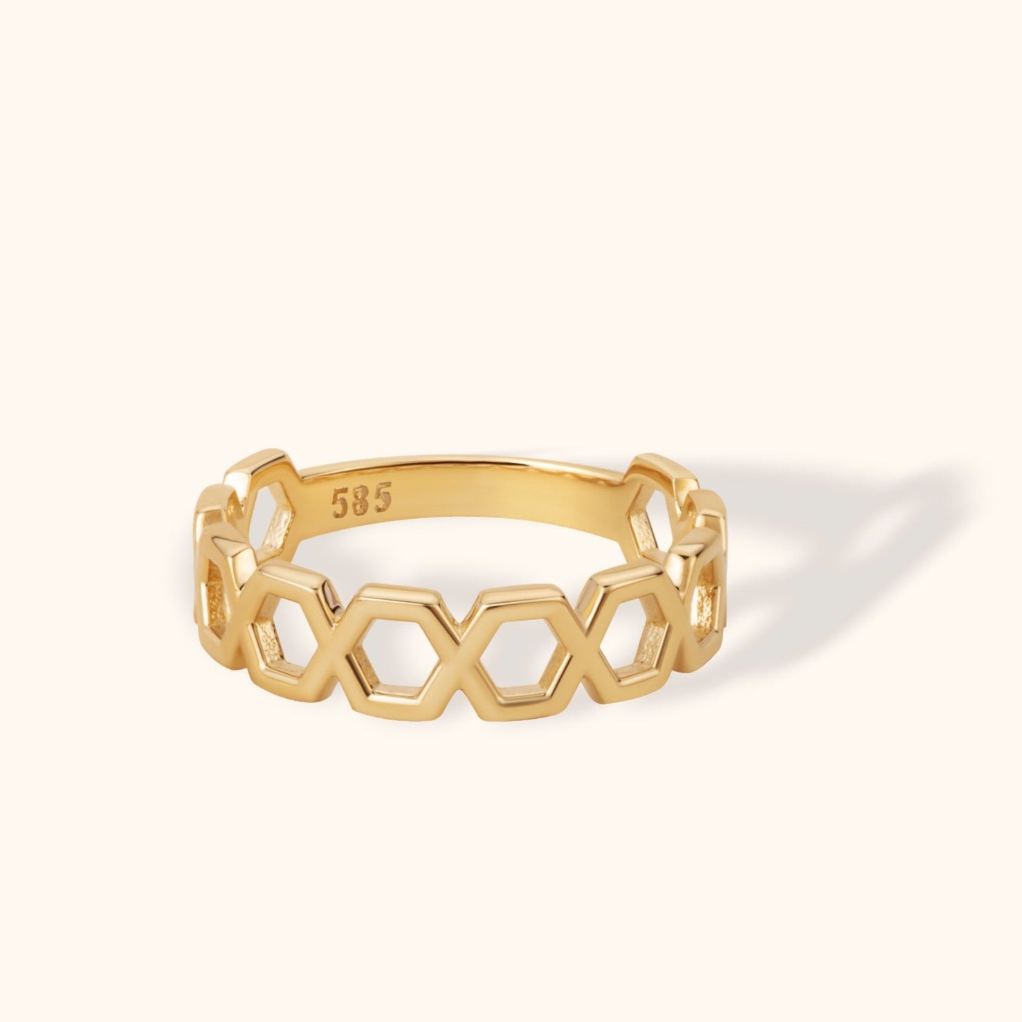 14K gold ring featuring an openwork honeycomb hexagon pattern in a sleek geometric design