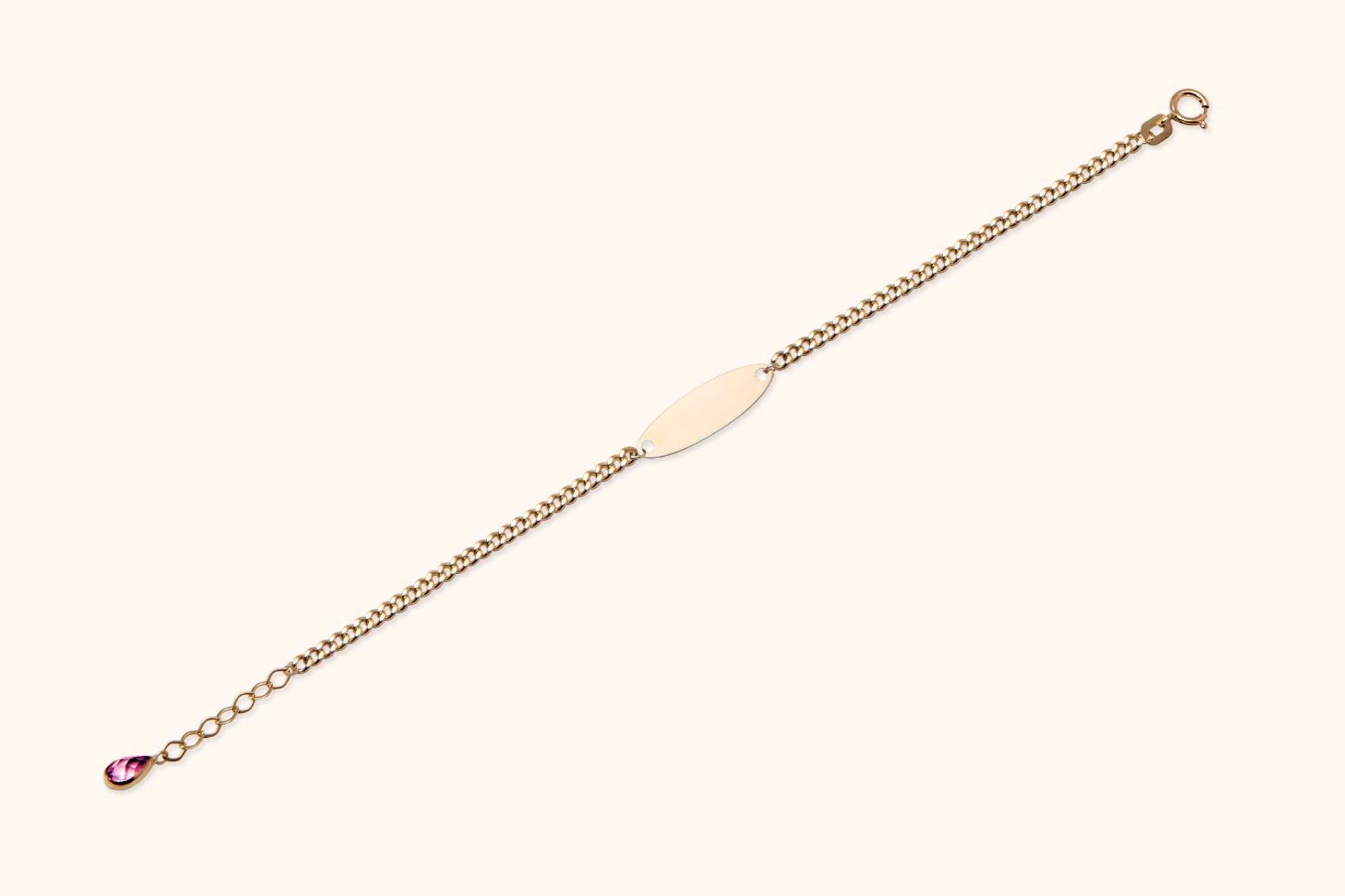 14K gold bracelet with ID plate and pink teardrop gemstone charm