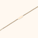 14K gold bracelet with ID plate and pink teardrop gemstone charm