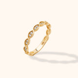 14K gold ring featuring marquise-cut diamonds in a twisted design, showcasing elegance and versatility.