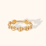 Minimal 14k gold ring with chain link design on a light cream background

