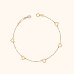 14K gold bracelet with five open heart charms on fine chain