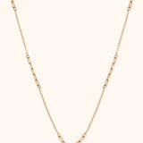 14K gold paperclip link necklace with alternating classic and elongated chain segments