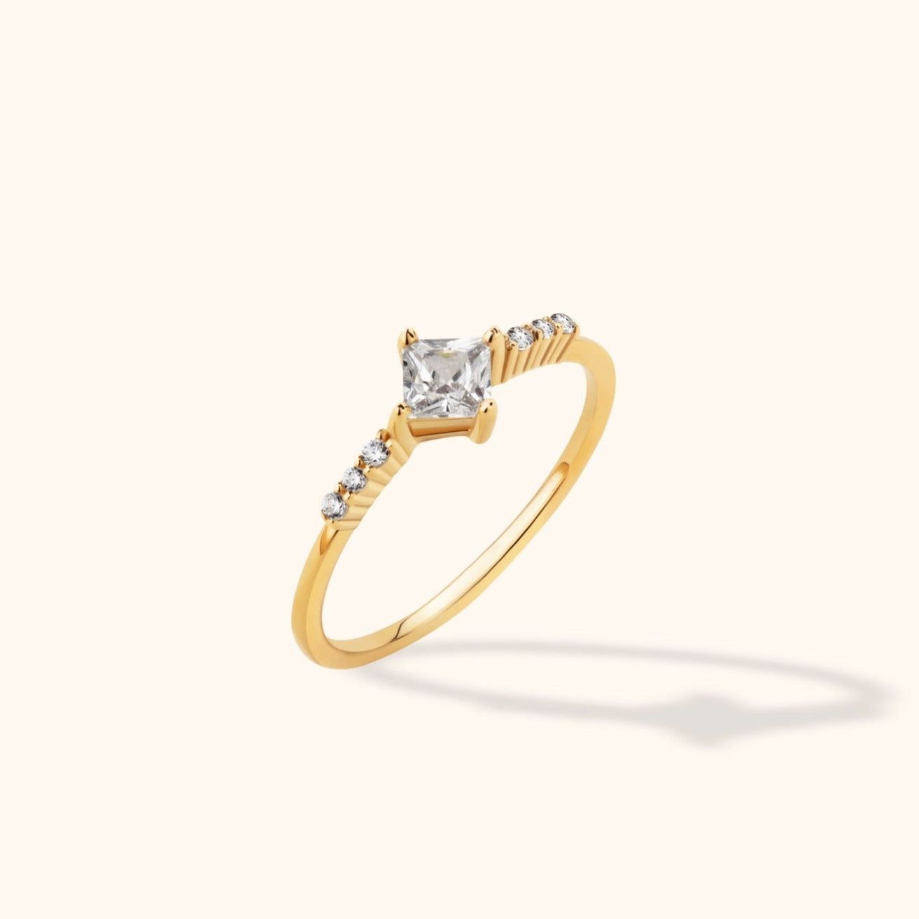 14K gold engagement ring with princess-cut solitaire and diamond side accents in modern dainty setting