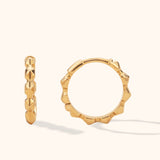 14K gold sculpted edge hoop earrings – bold textured mini gold huggies with wave-like faceted edges, modern twist on classic gold hoops