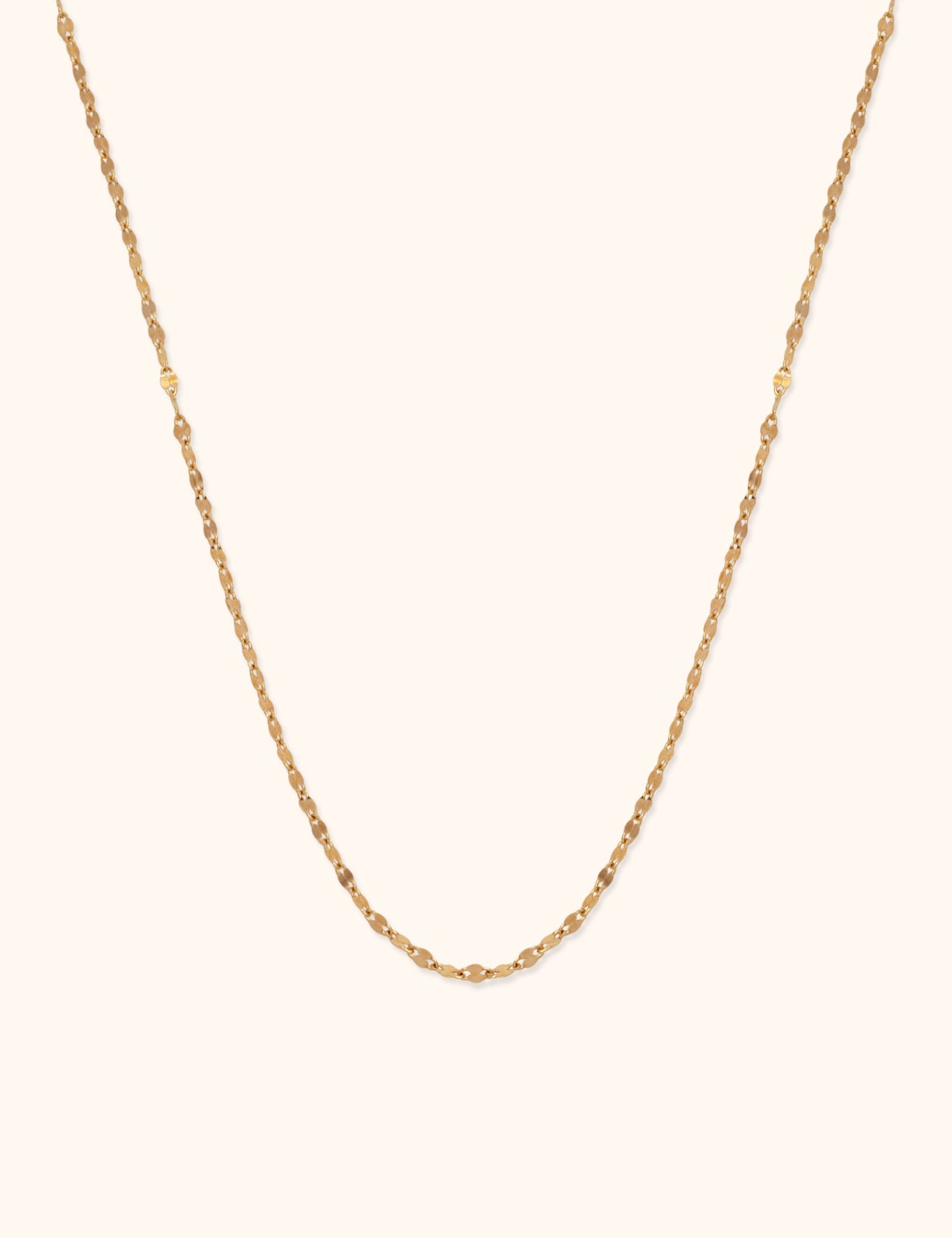 Minimal 14K gold necklace with bead-textured design and elegant shine