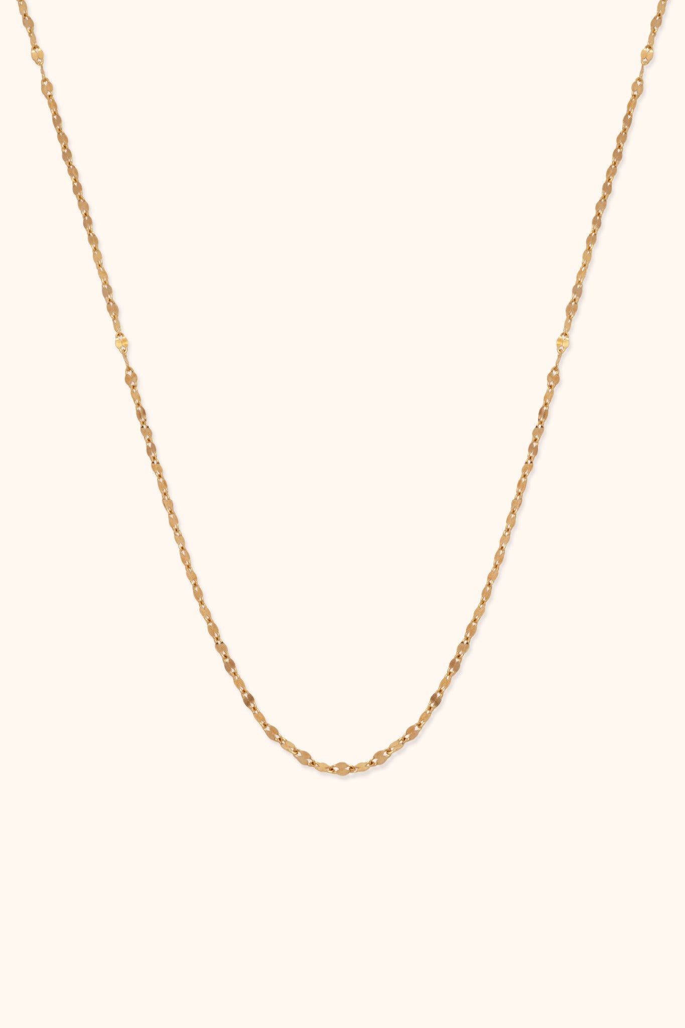 Minimal 14K gold necklace with bead-textured design and elegant shine