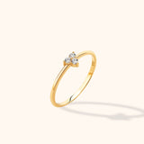 14K gold minimalist ring with three round diamonds in a clustered setting on a thin band