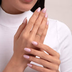 Elegant 14K gold ring featuring a delicate combination of tiny marquise and round diamonds on a woman's hand, creating a minimalist and graceful look.