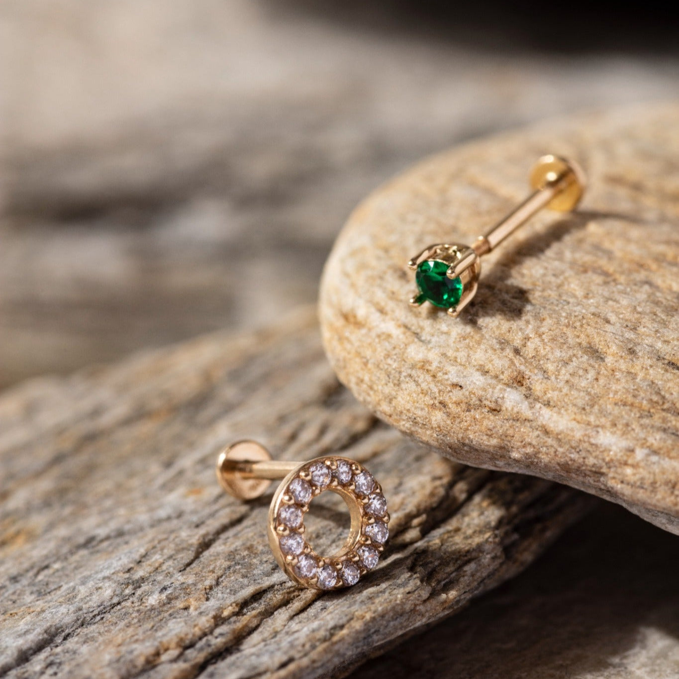 14K Gold Tragus Piercing Set featuring a pavé CZ circle stud and a minimalist green emerald-tone round stud – Elegant cartilage earrings perfect for stacking or solo wear, designed for tragus or helix placements.