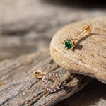 14K Gold Tragus Piercing Set featuring a pavé CZ circle stud and a minimalist green emerald-tone round stud – Elegant cartilage earrings perfect for stacking or solo wear, designed for tragus or helix placements