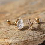 14K Gold Tragus Piercing Set featuring a pear-cut CZ stud and a pavé cross-shaped stud – Minimalist yet symbolic cartilage earrings perfect for tragus, helix, or upper lobe piercings