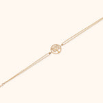 14K gold Tree of Life bracelet with double chain on light background