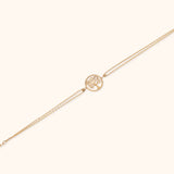 14K gold Tree of Life bracelet with double chain on light background