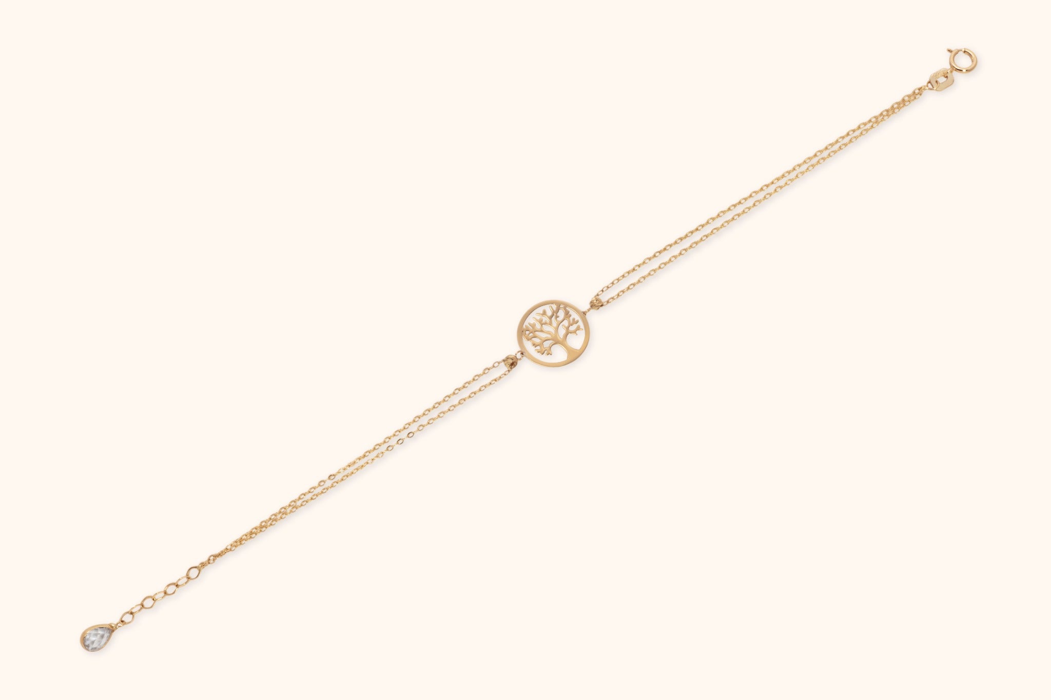 14K gold Tree of Life bracelet with double chain on light background