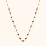 14K gold necklace with tricolor beads and zircon stones in an elegant station design