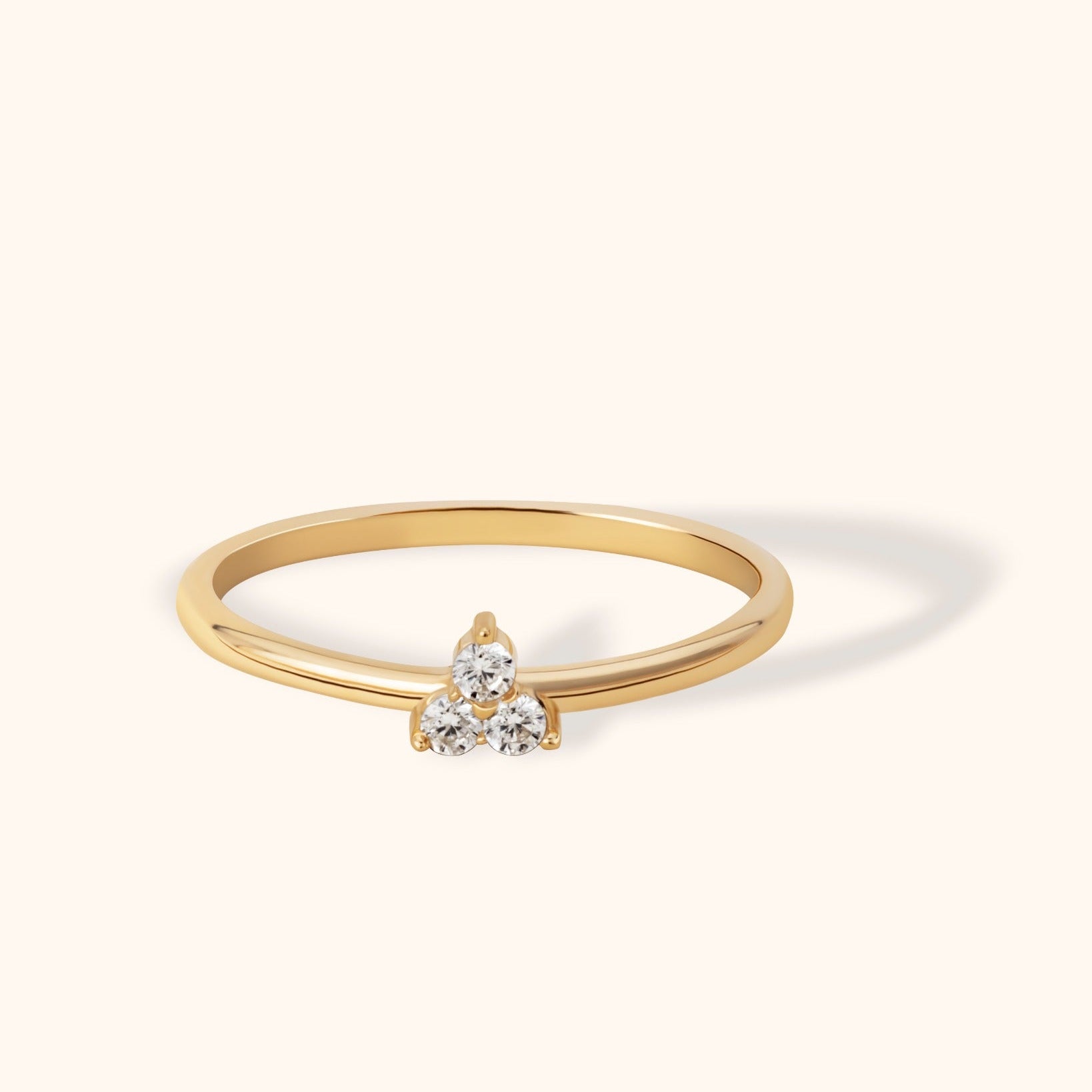 14K yellow gold ring with a minimalist three-diamond cluster set in a triangle formation