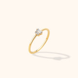 14K yellow gold ring featuring a row of baguette-cut diamonds in a minimalist and stackable design.