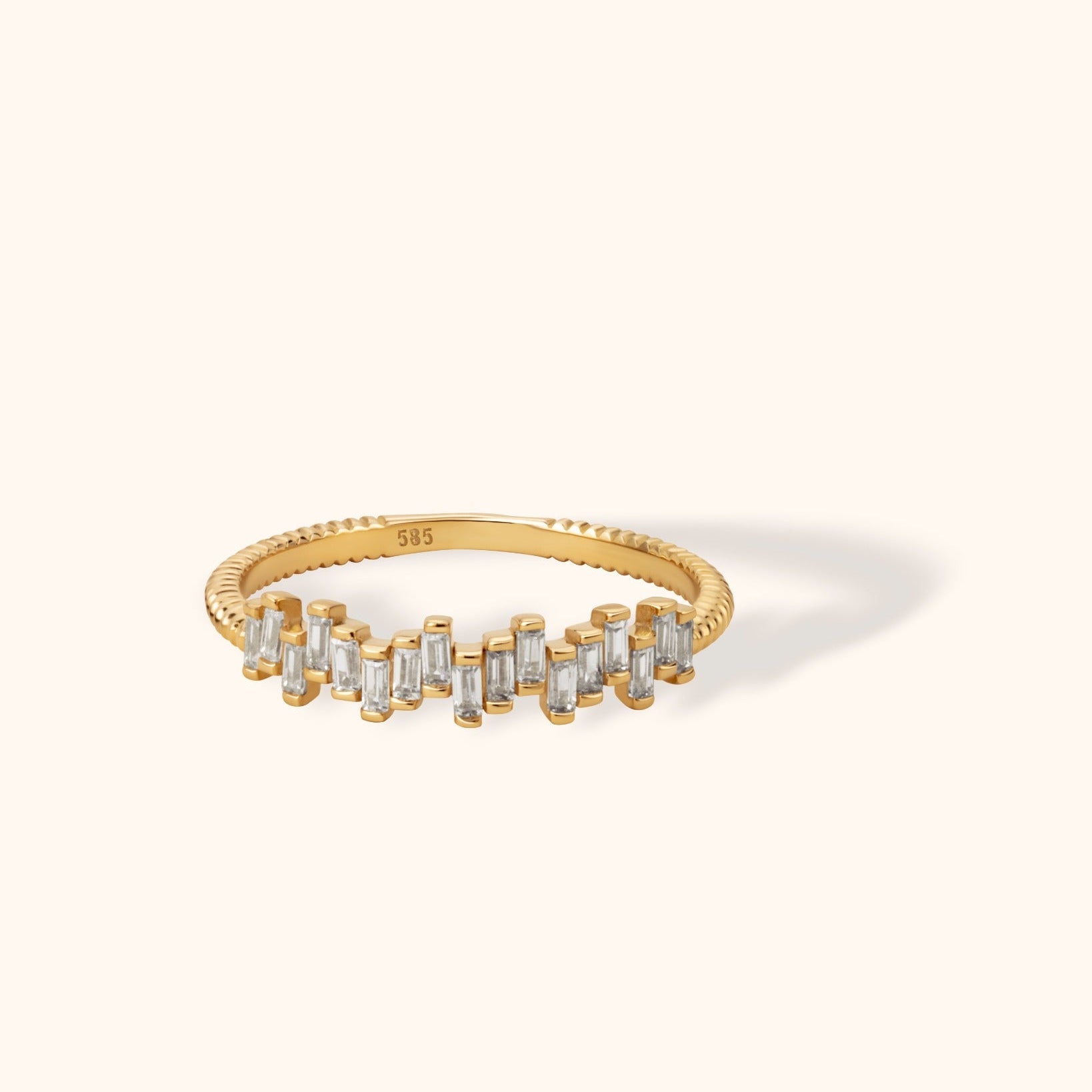 14K yellow gold ring featuring vertical baguette diamonds on a textured band, modern stackable style