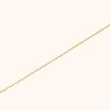 Minimalist 14K gold paperclip chain bracelet with elongated links, perfect for everyday wear or stacking.