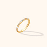 14K yellow gold half-eternity band with alternating baguette and round zircon accents, modern stackable ring style