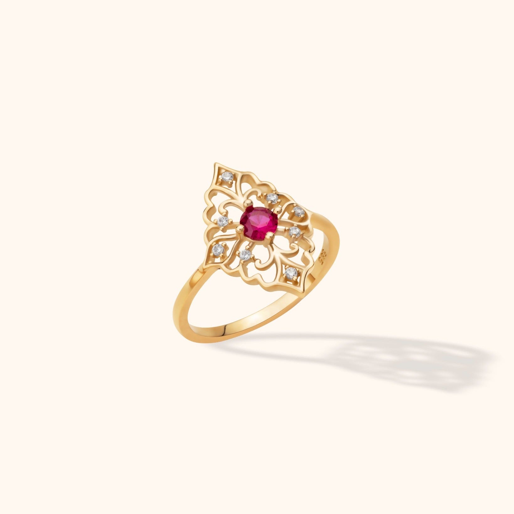 14K yellow gold filigree ring with round red zircon center and micro-set zircon accents