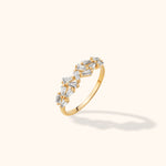 14K yellow gold band with a mixed-cut zircon cluster featuring baguette, tapered, and round stones for a statement look