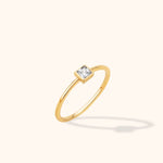 14K yellow gold bezel band with princess cut zircon center, minimalist engagement ring style