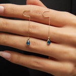14K gold threader earrings with pear-shaped blue sapphire gemstones on fine gold chain