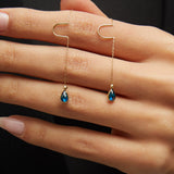 14K gold threader earrings with pear-shaped blue sapphire gemstones on fine gold chain