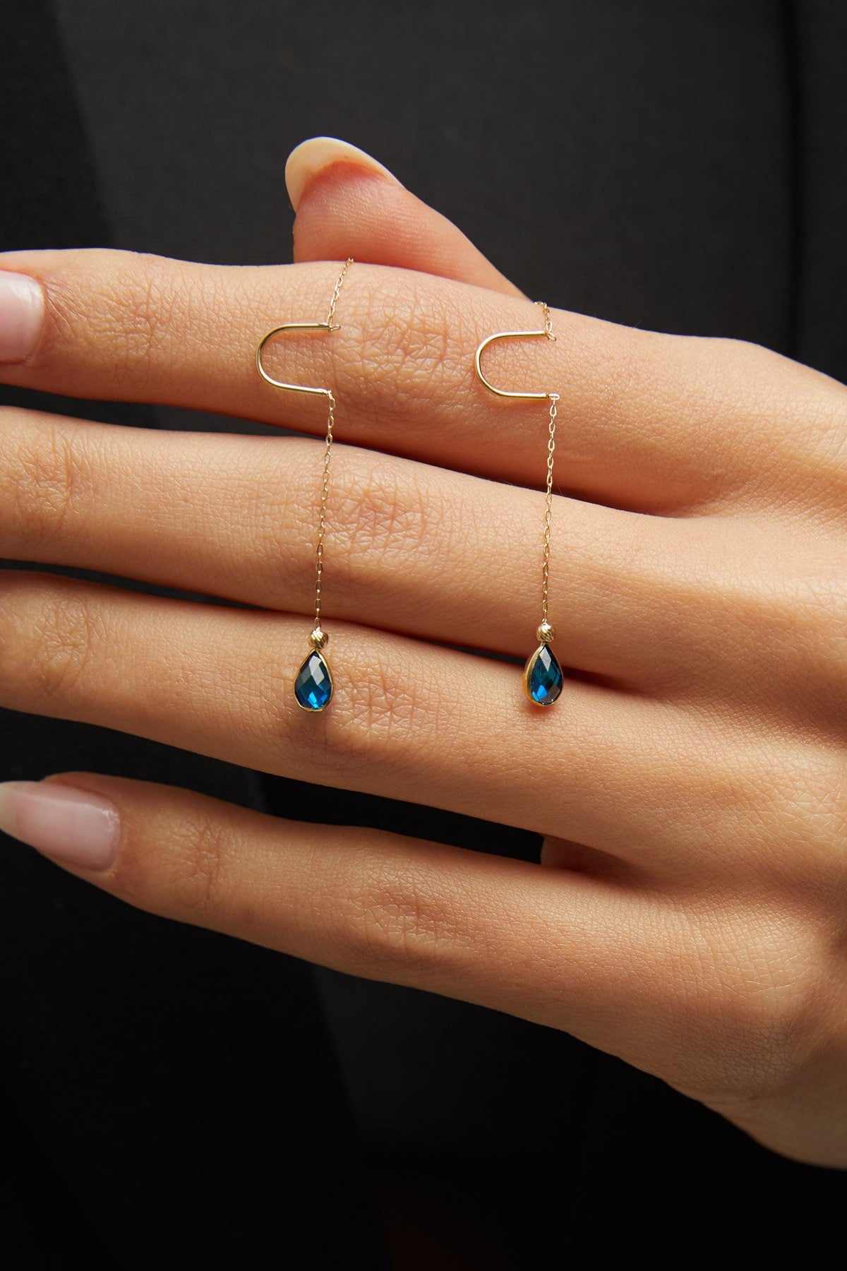 14K gold threader earrings with pear-shaped blue sapphire gemstones on fine gold chain