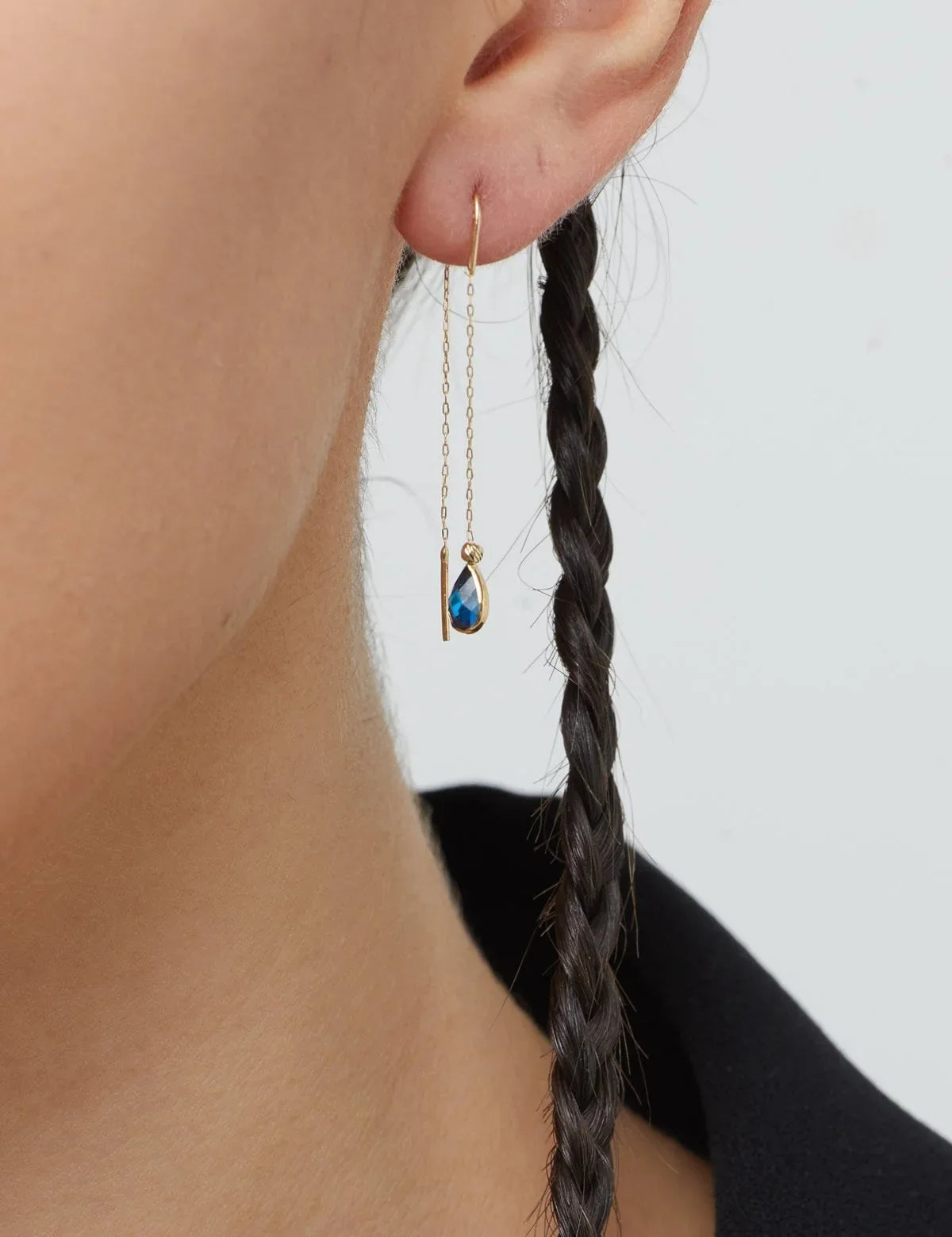 14K gold threader earrings with pear-shaped blue sapphire gemstones on fine gold chain