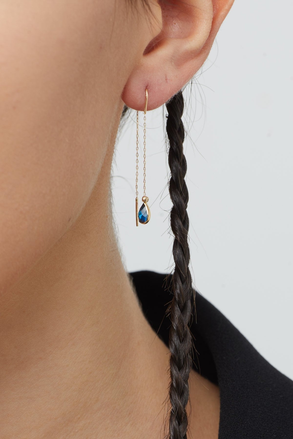 14K gold threader earrings with pear-shaped blue sapphire gemstones on fine gold chain